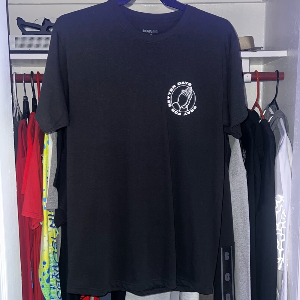 Black and White tee shirt with large back design.
